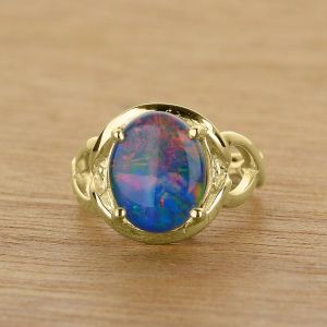 Contemporary 10x8mm Oval Opal Ring in Twisting Band 14K or 18K Gold by Anderson-Beattie.com